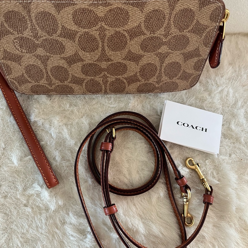 LIKE NEW COACH KIRA CROSSBODY with signature canvas.
